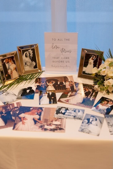 A display of family wedding photos at a wedding reception at the Opal Sands Resort on Clearwater Beach.