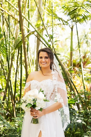 A bride in the gardens at Sunken Gardens in St. Petersburg, Florida.