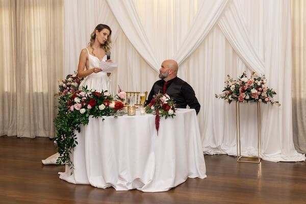 A bride making a toast at her Tampa Bay wedding