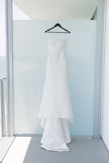 A bridal gown hanging on a terrace at their Opal Sands Resort.