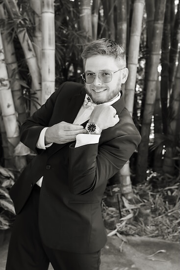 A groom showing off hius new watch.