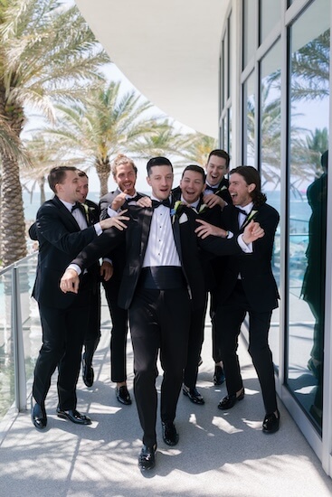 Groomsmen having some prewedding fun with the groom.