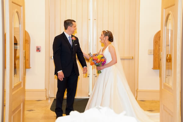 A bride and groom's first look just before their St. Pete wedding ceremony.