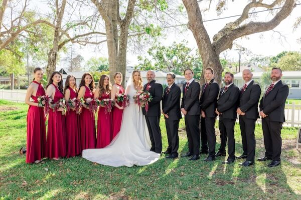 Bride and groom with thier wedding party after thier Tampa Bay wedding ceremony.
