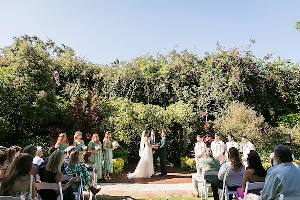 An outdoor wedding ceremony at Sunken Gardens in St. Petersburg, Florida.