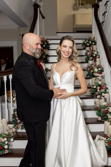 The bride and groom are ready to welcome guests to their Tampa Bay wedding reception.
