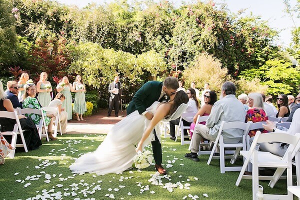 An outdoor wedding ceremony at Sunken Gardens in St. Petersburg, Florida.