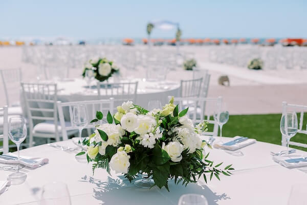 Beautiful white and green centerpíeces for a Clearwater Beach wedding reception.