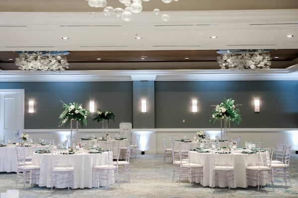 A beautiful white and green wedding reception at the Hyatt Regency Clearwater Beach.