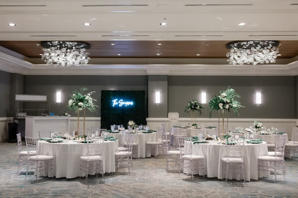 A beautiful white and green wedding reception at the Hyatt Regency Clearwater Beach.