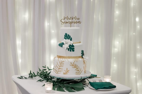 A three tiered tropical wedding cake.
