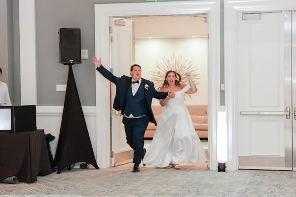 A bride and groom making their entrance at their Clearwater Beach wedding reception.