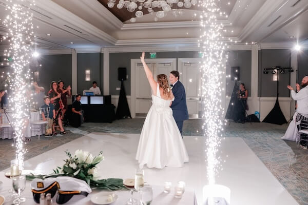 A bride and groom making their entrance at their Clearwater Beach wedding reception.