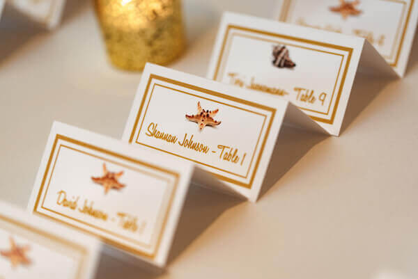 Escort card with sea shells for a Florida wedding