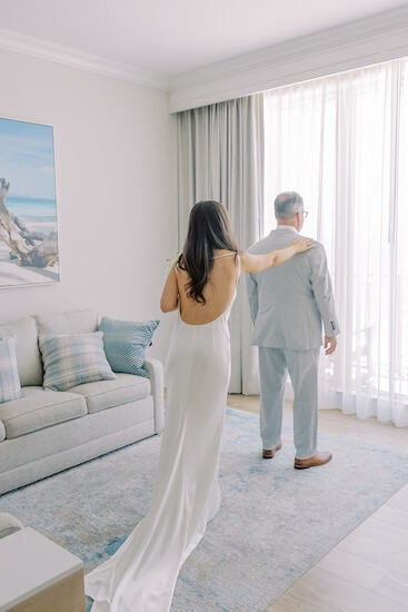 A dad's first look with his daughter before her Clearwater Beach wedding.