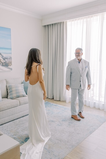 A dad's first look with his daughter before her Clearwater Beach wedding.
