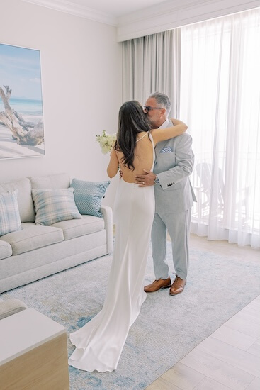 A dad's first look with his daughter before her Clearwater Beach wedding.