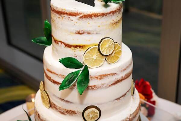 Semi-naked wedding cake with citrus for a Florida wedding. 
