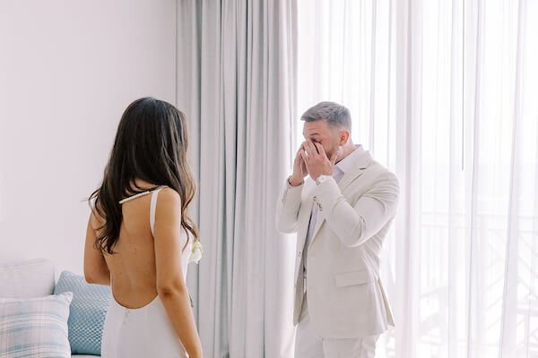 A bride and groom's first look before their Clearwater Beach wedding.