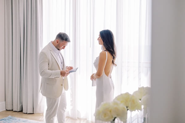 A Bride and groom exchanging their wedding vows in private before their Clearwater Beach wedding.