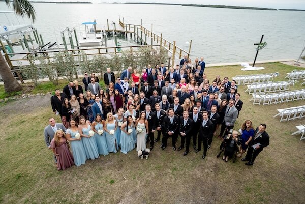 All of the wedding guests gathered for one big wedding photo at Tampa Bay Watch.