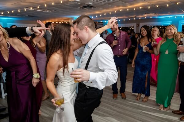 A newlywed couple dancing the night away at their Tampa Bay Watch wedding.