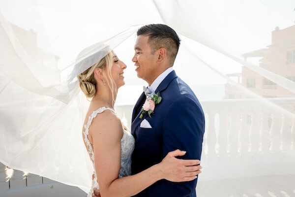 A newlywed couple's wedding portraits after their Hyatt Regency Clearwater Beach wedding.