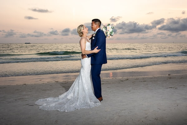 A newlywed couple's wedding portraits after their Hyatt Regency Clearwater Beach wedding.
