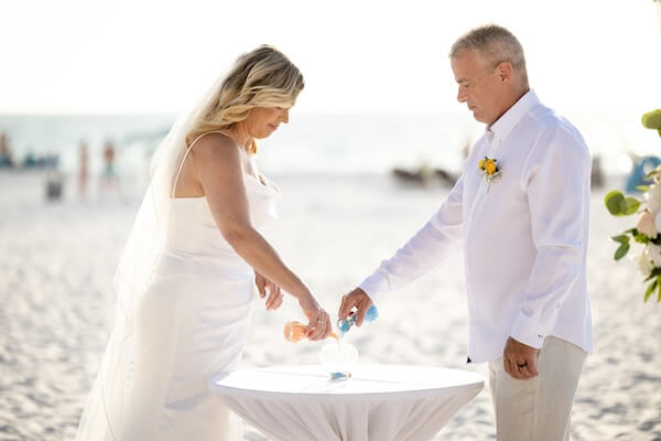 A unity celebration during a wedding ceremony on Clearwater Beach.