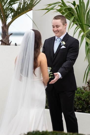 A bride and groom's first look before their Tampa Bay Watch wedding.