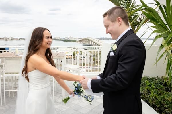 A bride and groom's first look before their Tampa Bay Watch wedding.