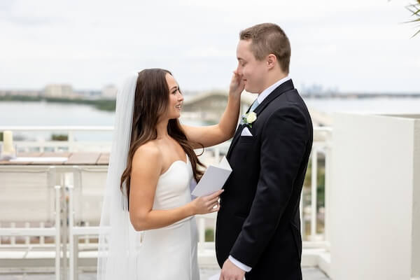A bride and groom's first look before their Tampa Bay Watch wedding.