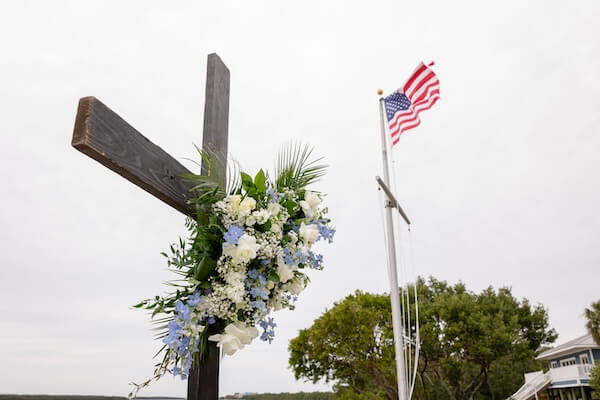 A cross and American flag at Tampa Bay Watch.