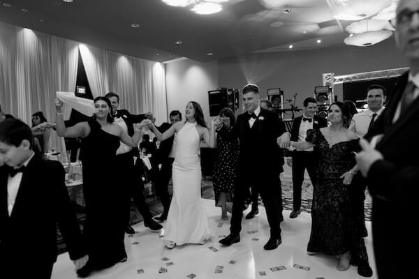 Traditional Albanian dancing at an Opal Sands wedding reception.