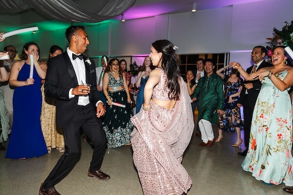 A newlywed couple dancing the night away at their Tampa Garden Club wedding reception.