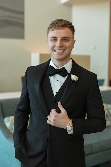 A happy groom beofre his Opal Sands wedding.