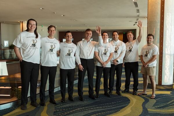 The groom and his groomsmen wearing fun tshirts before his Opal Sands wedding.