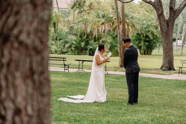 A bride and groom exchange vows in private before their Tampa wedding.