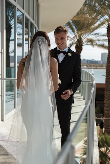 A bride and groom's first look before their Opal Sands wedding ceremony.