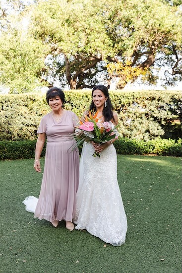 A bride walking down the aisle at her Tampa Garden Club wedding.