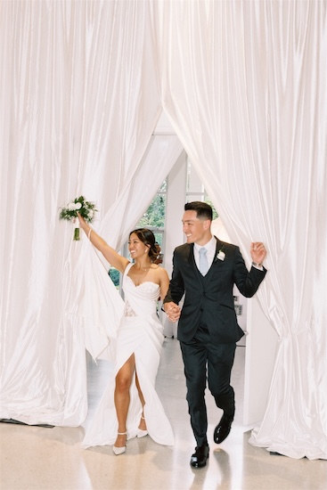 A bride and groom's grand entrance at their Tampa wedding reception.