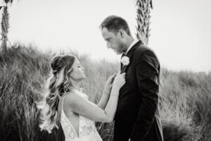 A newlywed bride and groom on Clearwater Beach after their Opal Sands wedding.