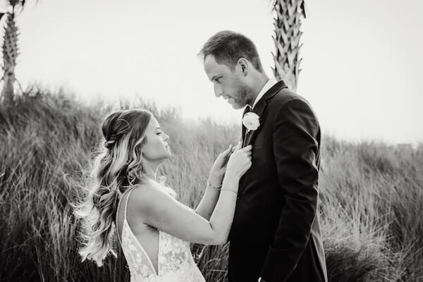 A newlywed bride and groom on Clearwater Beach after their Opal Sands wedding.