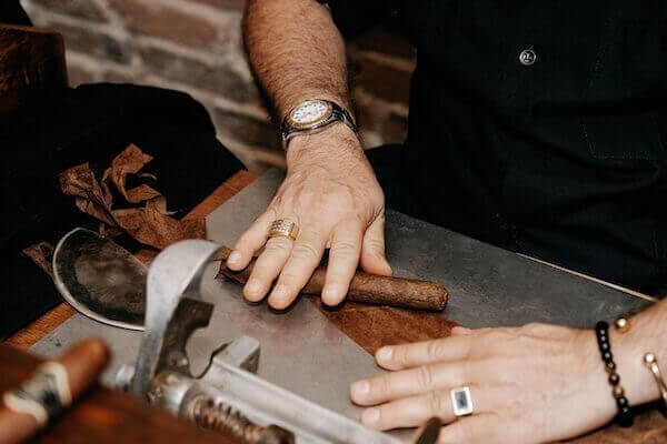 Cigar roller at a tampa wedding reception.