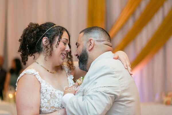 A birde and groom's first dance at their Wyndham Grand Clearwater Beach wedding reception.