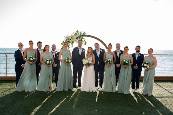 Wedding party photos on the event lawn at the opal sands resort.