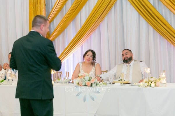 Toasting a newlywed couple during thier Wyndham Grand Clearwater Beach wedding reception.