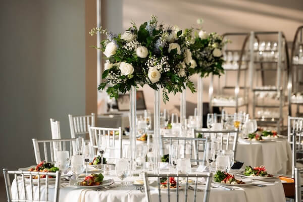 White wedding decor with touches of light blue and silver.