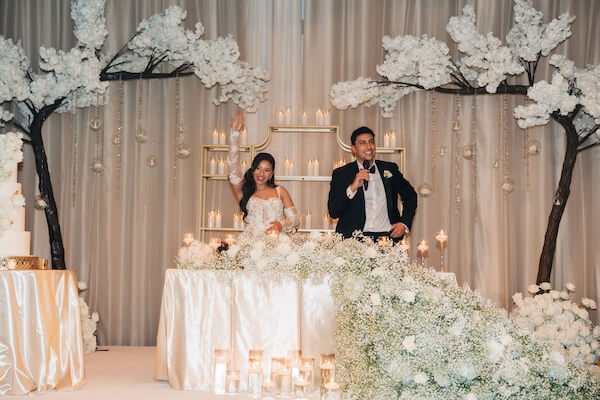 A groom sharing a blessing at his Clearwater wedding reception.