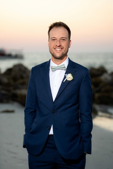 A groom after his Opal Sands wedding.